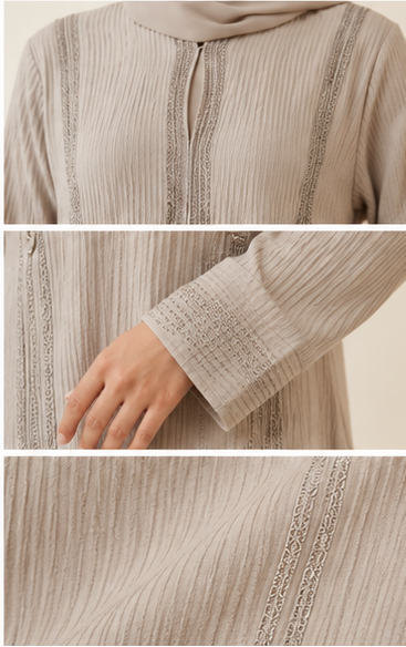 Woman wearing beige ribbed textured abaya with rhinestone embellished panels and hijab