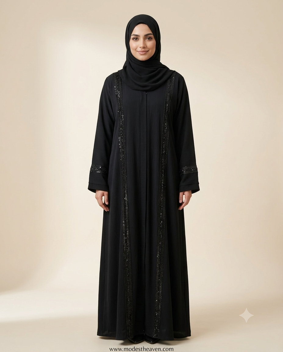 Woman wearing black sequin trim open front abaya with black hijab full length view