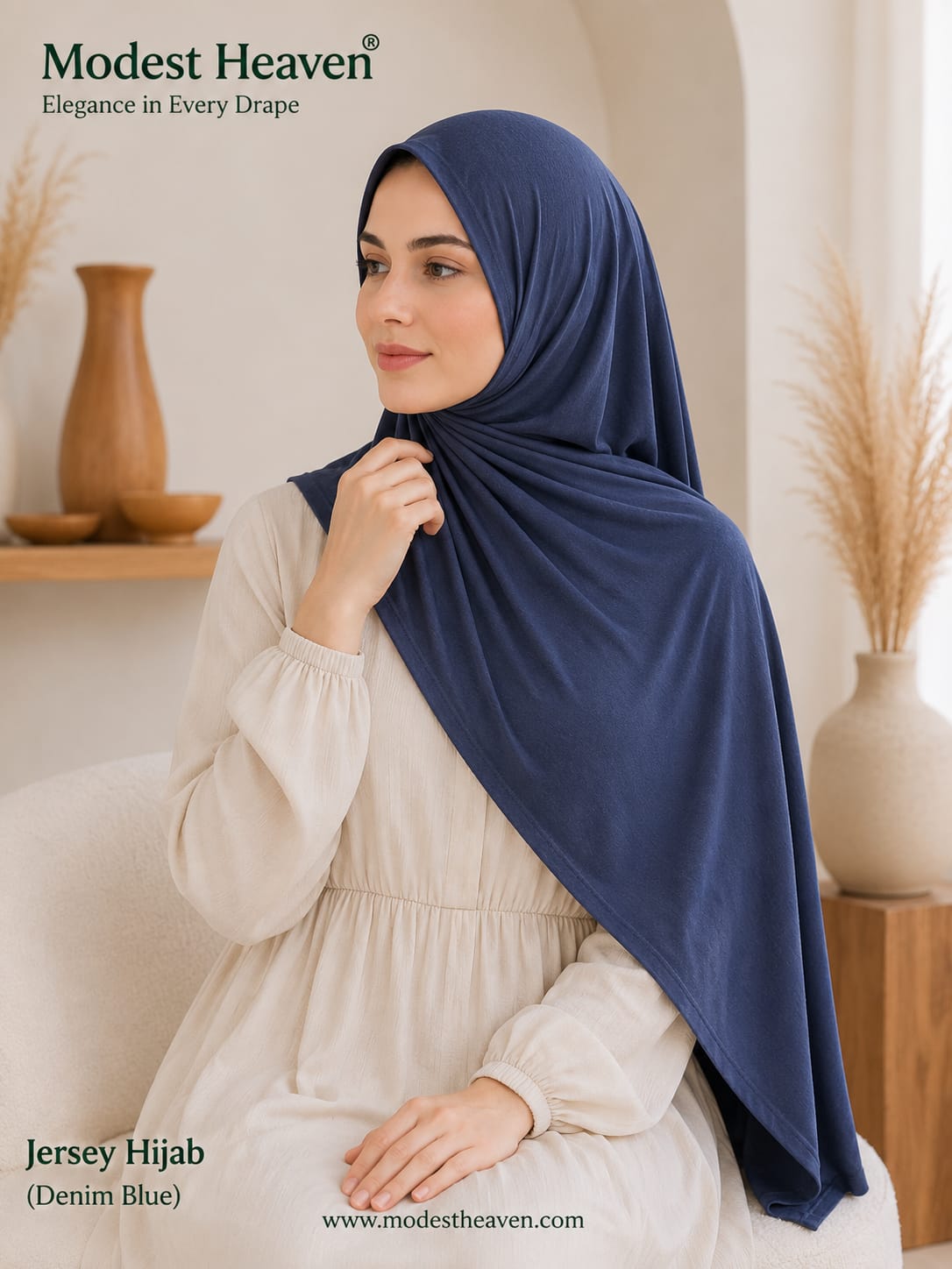 Woman wearing denim blue premium jersey hijab, seated portrait view