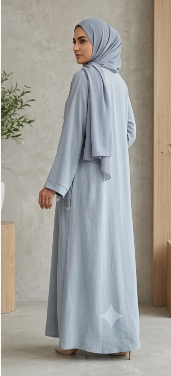 Woman wearing dusty grey feather embroidered abaya with matching hijab, full-length 