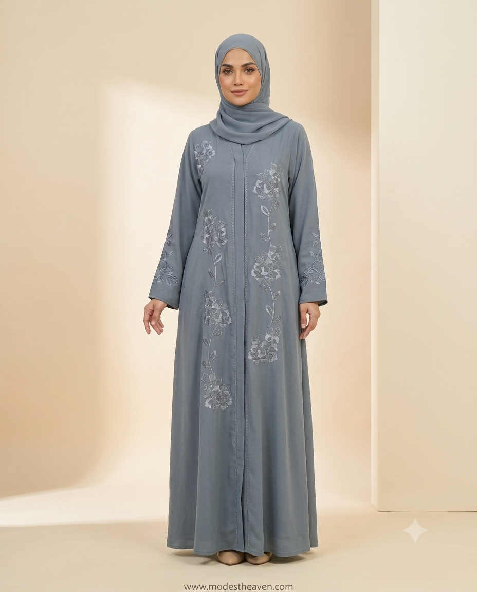 Woman wearing grey open abaya with floral embroidery and matching hijab
