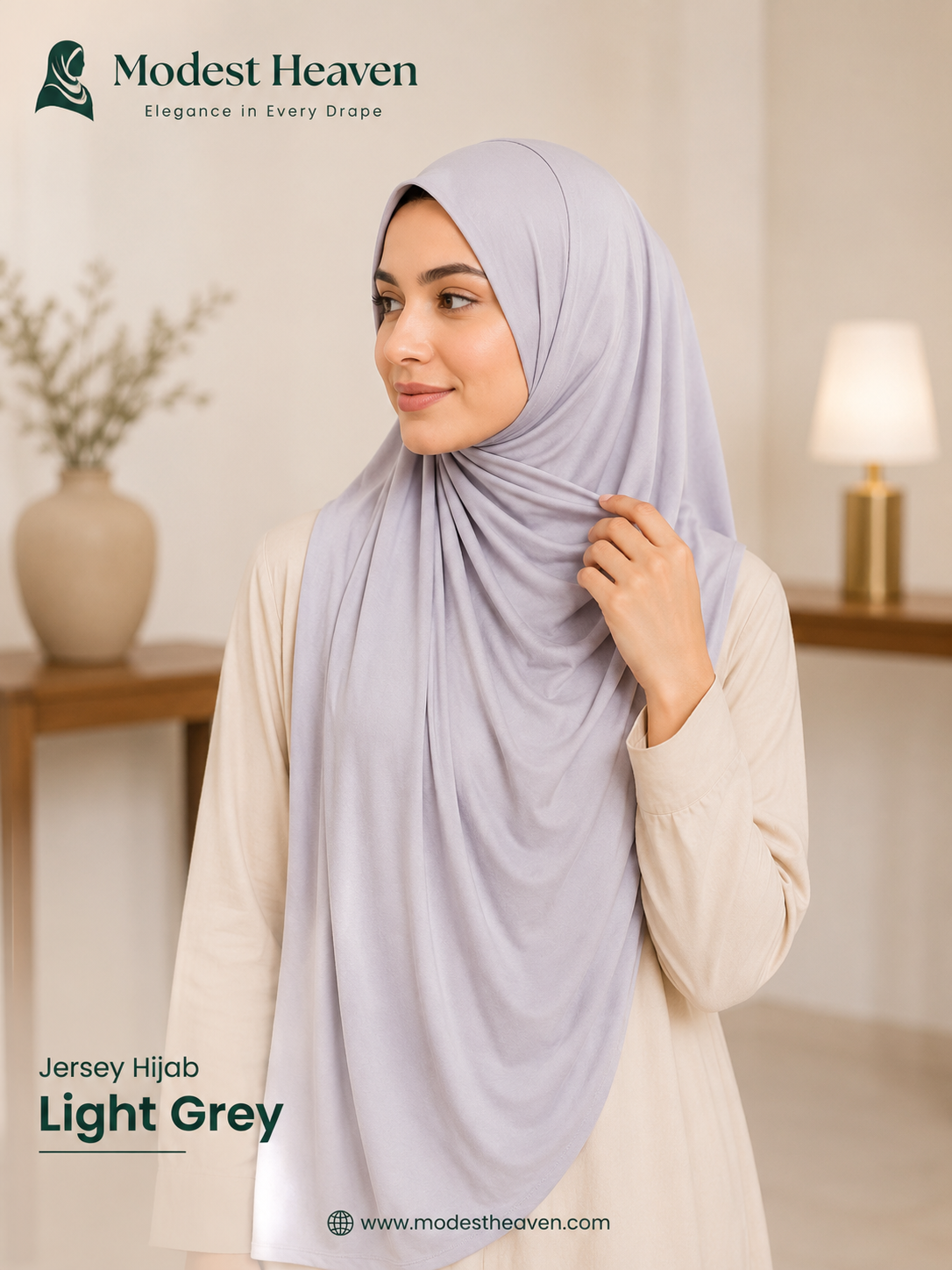 Woman wearing light grey premium jersey hijab, portrait view