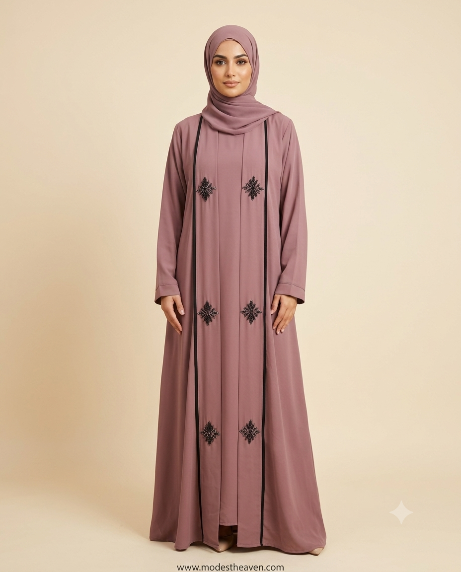 Woman wearing mauve embroidered open abaya with black floral motifs and hijab
