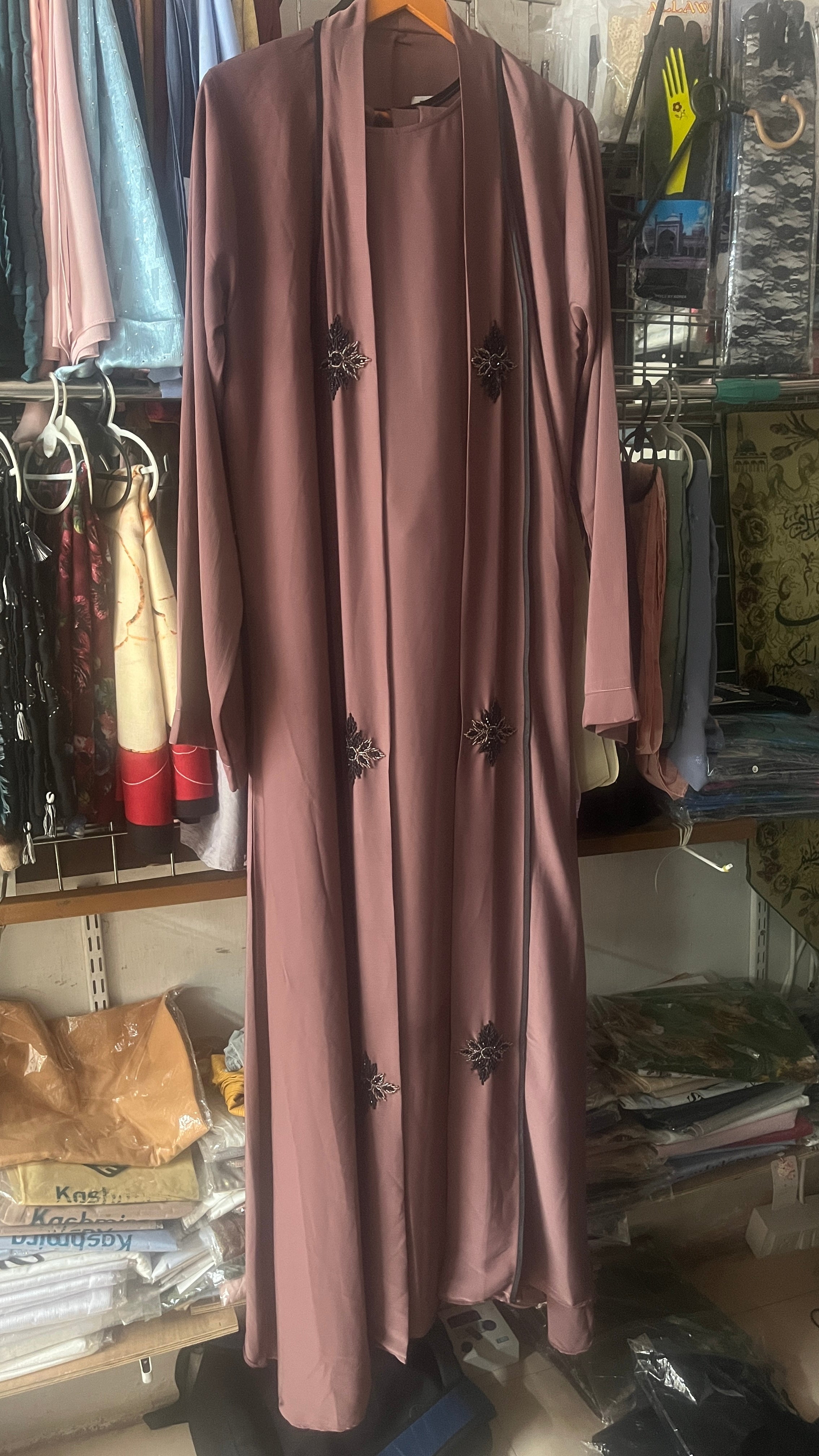 Mauve open front embroidered abaya full length view on hanger