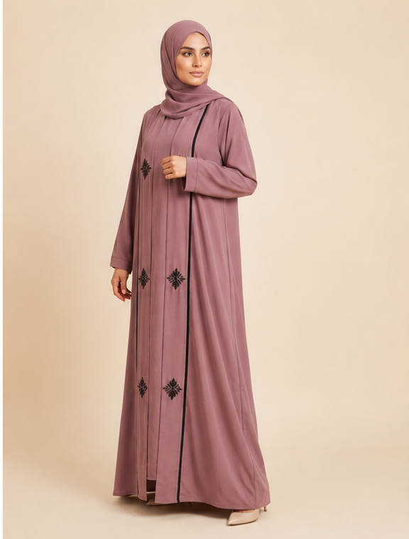 Woman wearing mauve embroidered open abaya with black floral motifs and hijab