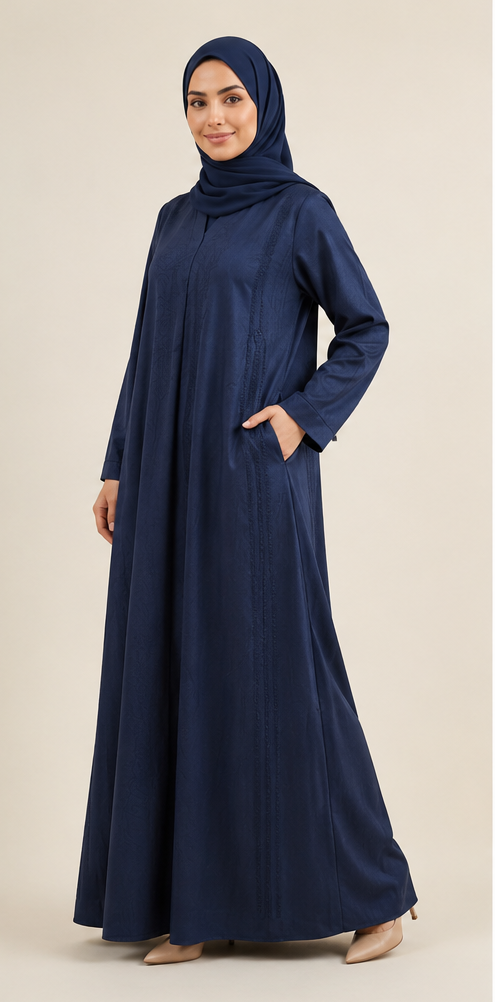 Woman wearing navy blue jacquard closed abaya with matching hijab full length front view