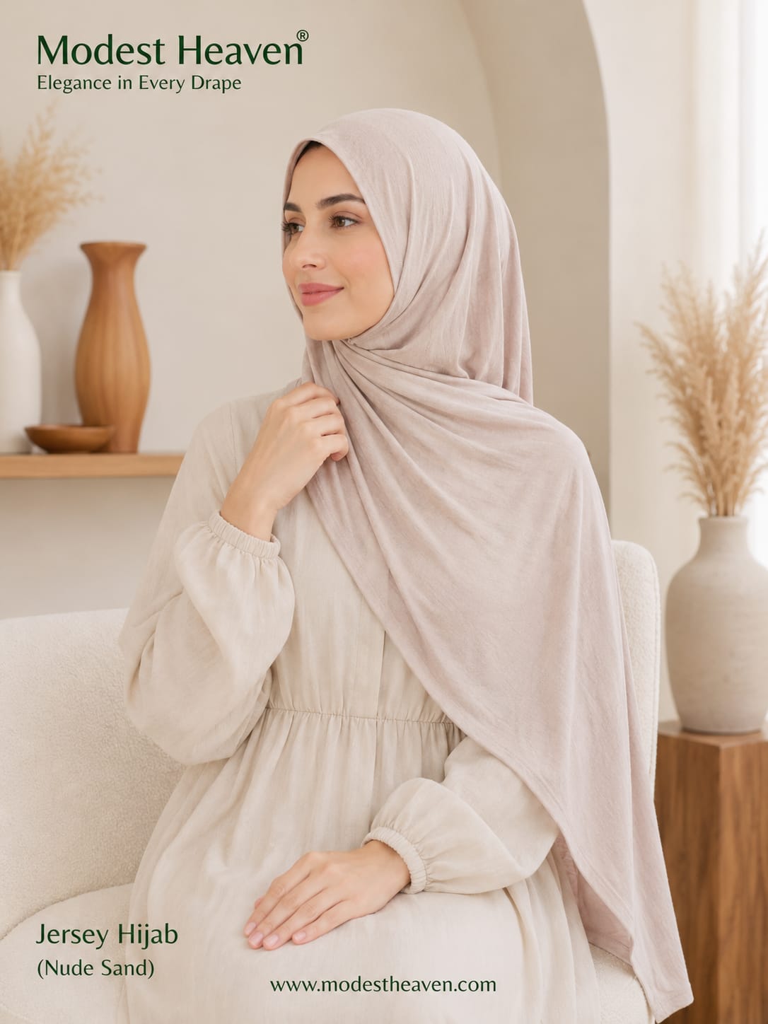 Woman wearing nude sand premium jersey hijab, seated portrait view