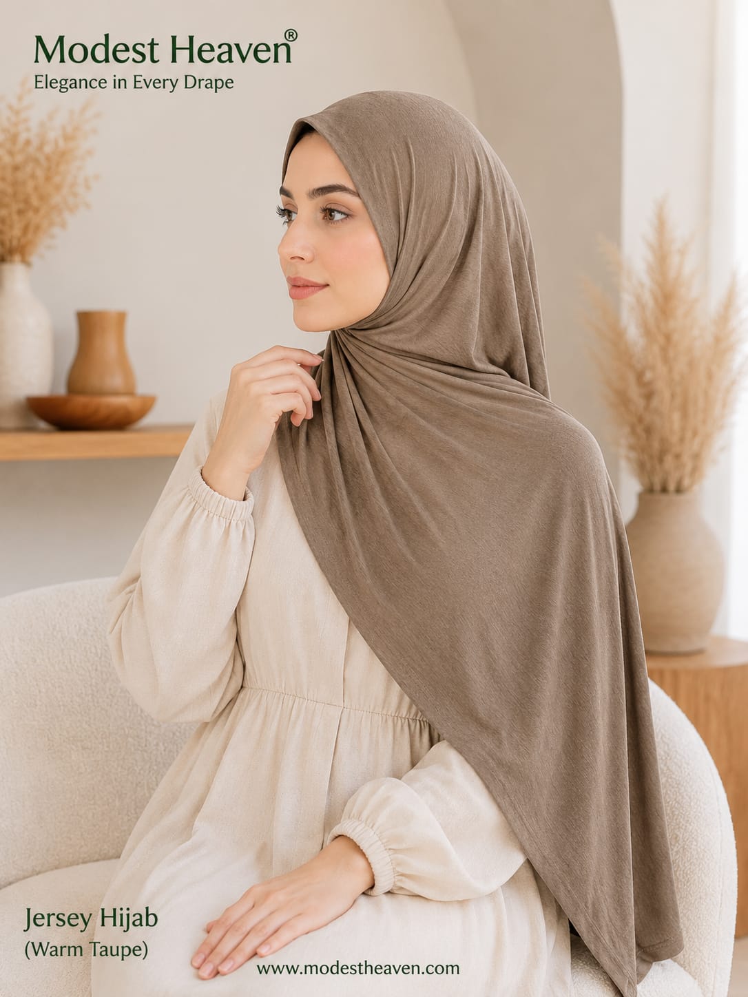 Woman wearing warm taupe premium jersey hijab, seated portrait view